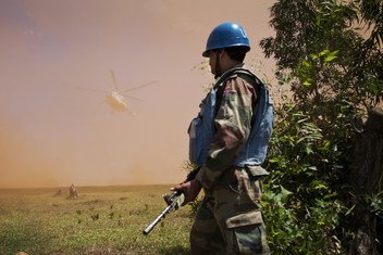 An Indian Peacekeeper stands near helipad as a MONUSCO helicopter carrying DRC Minister of Communication Lambert Mende lands near Kanyabayonga COB, the 5th of June 2014.