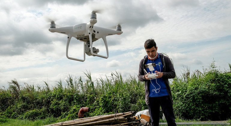 Digital technology being used to improve agricultural methods in the Philippines: Department of Agriculture experts, working with the Food and Agriculture Organization (FAO) using drones to gather visual data on recently damaged rice crops in Magalang tow