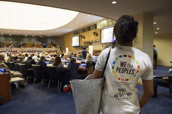 A young woman wears a shirt bearing the logo of the 67th DPI/NGO Conference at United Nations Headquarters in New York, 22 August 2018.