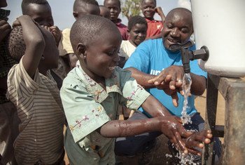 Teaching children how to correctly wash their hands to prevent the spread of Ebola near Mangina, North Kivu, the Democratic Republic of the Congo.