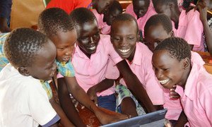 Students using tablets from the Instant Network Schools (INS) project in Kakuma Refugee Camp in Kenya. 