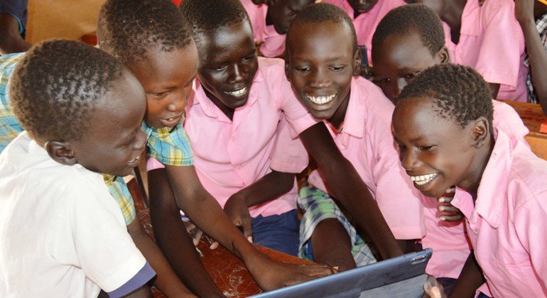 Students using tablets from the Instant Network Schools (INS) project in Kakuma Refugee Camp in Kenya.  The INS project is a collaborative effort between UNHCR and the Vodafone Foundation.