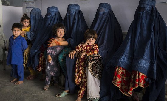 Afghan refugees, who have made the difficult decision to voluntarily return home to Afghanistan, some after decades living in Pakistan, here pictured at UNHCR's voluntary repatriation centre in Peshawar, which provides administration and services to help 