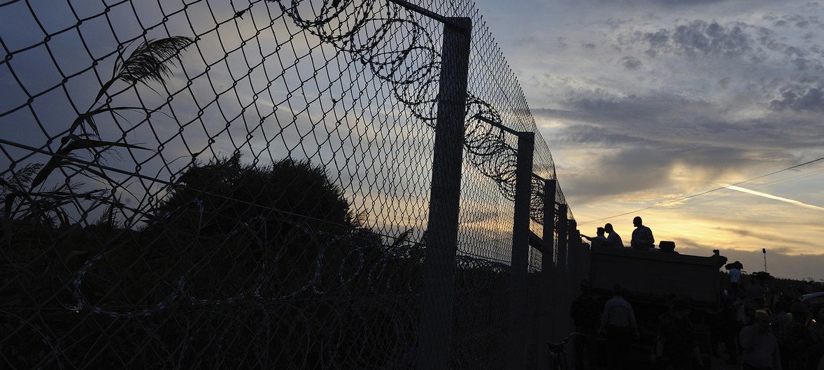 Hungary's strengthened razor wire border fence along an old railway line, to block the path of refugees and migrants. File photo, September 2015.