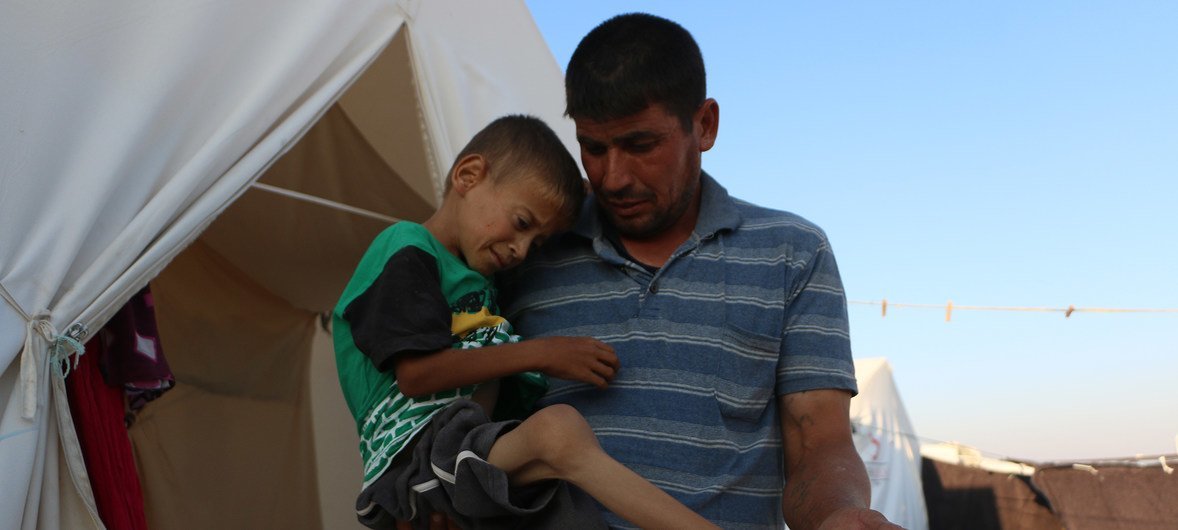 On 29 August 2018 in the Syrian Arab Republic, Yamen (left), 11, was displaced with his family from Al-Houla in northern rural Homs and now lives in a tented camp in northern rural Idlib. Yamen has developmental delays and requires specialized medical car