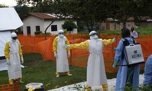 On 14 September 2018, medical workers are thoroughly cleaned after visiting patients at an Ebola treatment centre in Butembo, Democratic Republic of Congo, after a recent outbreak of the deadly disease.