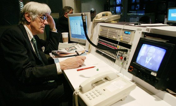 Edward Mortimer, head speechwriter for Secretary-General Kofi Annan, monitors a video being recorded by Mr. Annan for UN Day in 2004.