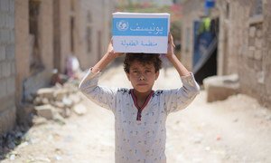A 12-year-old boy carries soap supplied by the UN in the Bani Harith neighbourhood of Sana’a in Yemen. (September 2018)