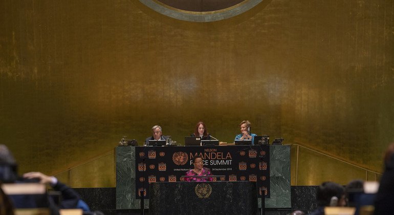 Graça Machel (center), member of The Elders and widow of Nelson Mandela, makes remarks during the Nelson Mandela Peace Summit at the General Assembly on 24 September 2018. Also pictured on the dais (left to right): Secretary-General António Guterres, Gene