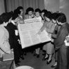 A group of Japanese women look at the Universal Declaration of Human Rights during a visit to the UN's interim headquarters in Lake Success in February 1950
