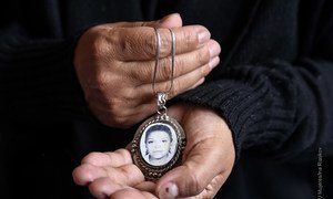 In Mexico, a mother keeps a portrait of murdered daughter in a locket (file).
