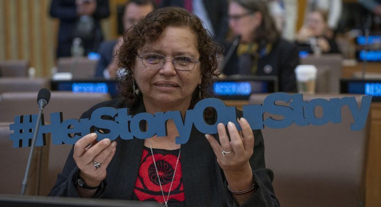 Morena Herrera, social activist from El Salvador, holds the sign "Her Story Our Story" at the launch of the Spotlight Latin America programme, which will fund targeted interventions, aiming to eradicating femicide in Latin America.