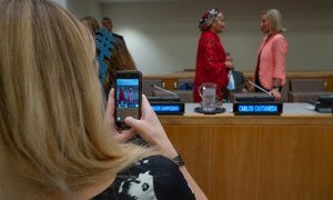 A participant takes a photo of Deputy Secretary-General Amina Mohammed (left) speaking with Federica Mogherini, European High Representative for Foreign Affairs, at the launch of the EU-UN Spotlight Latin America programme. 27 September 2018.