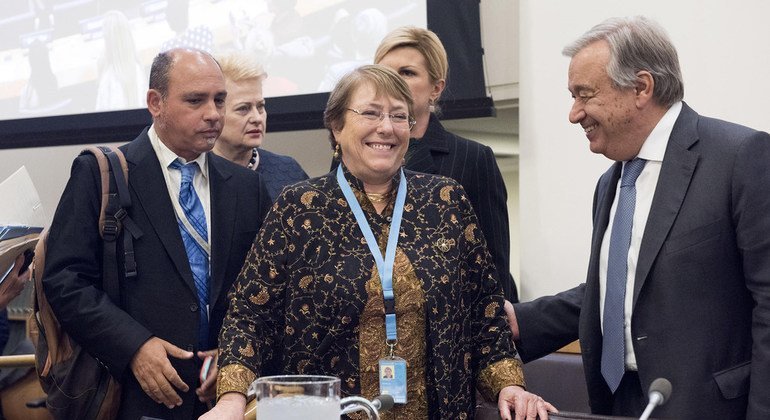 Secretary-General António Guterres (right), greets Michelle Bachelet (centre), United Nations High Commissioner for Human Rights, during an event on economic growth through women's empowerment. 27 September 2018.