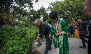 Secretary-General António Guterres plants and waters a tree at the newly-inaugurated ONE UN House in New Delhi.