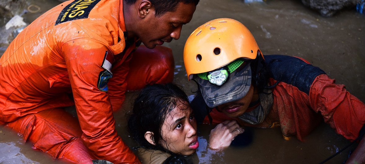 A 15-year old girl is rescued from the rubble of her house in central Sulawesi on 30 September 2018.