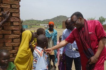 Marcel Clement Akpovo (right), UNAMID Chief of Human Rights, is interacting with IDPs at Aralciro IDP gathering site during his recent visit to Golo, Central Jabal Marra locality, Darfur, Sudan.