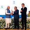 Secretary-General António Guterres (centre) honors Prime Minister Narendra Modi of India with the Champion of Earth award, the highest environmental honour of the United Nations, at Pravasi Bharatiya Kendra in New Delhi. UN Environment Executive Director Erik Solheim (right) looks on.