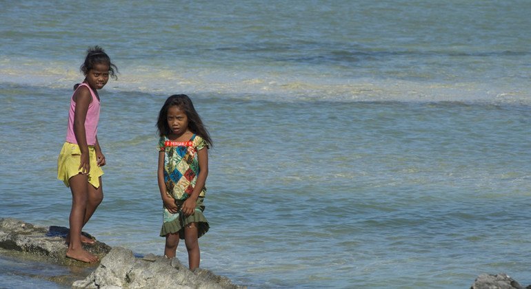 Children in the village of Tebikenikora, in Kiribati, Central Pacific.