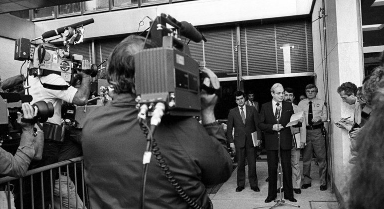 In July 1982, the UN Secretary-General Javier Perez de Cuellar (at microphone) briefs the media at UN headquarters in New York after meeting British and Argentinian negotiators in the Falkland Islands/Malvinas crisis.