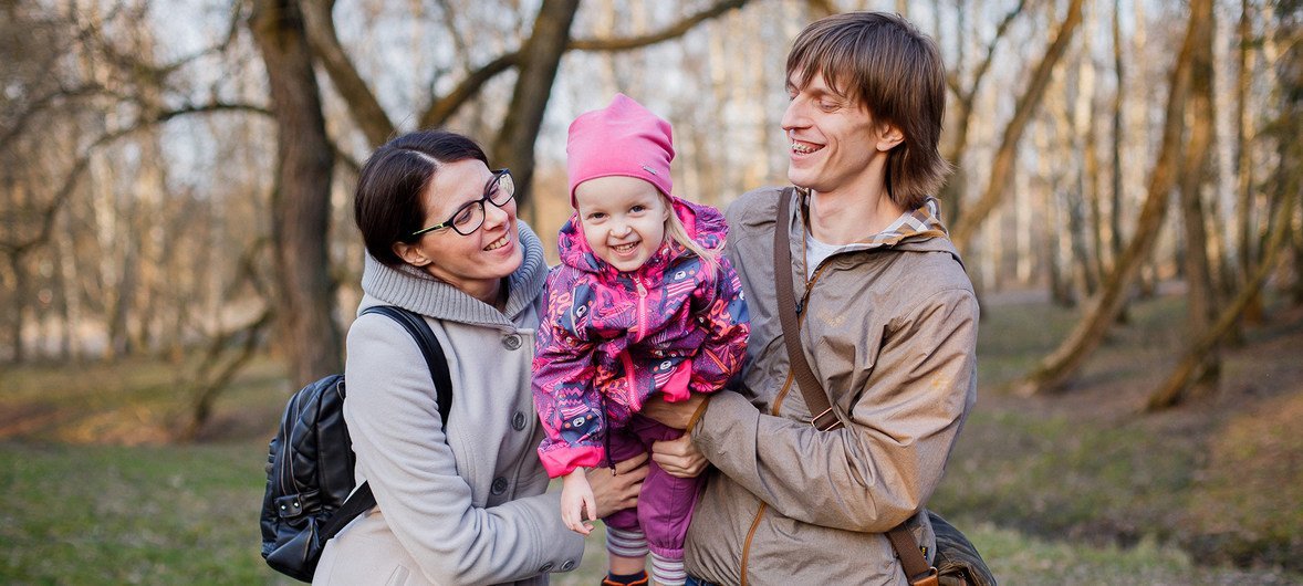 Olga and Andrey with their three year old daughter Yulia.  Olga and Andrey say they would like a larger family but do not have more children due to limited economic means.  Belarus, 2018.