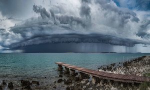 A shelf cloud, attached to the base of the parent cloud approaches the coast of the Island of Pag in Croatia.
