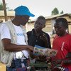 On 12 September 2018 in Beni, a UNICEF staff member discusses the best way to protect yourself against Ebola in a conversation with young people living in Beni, Democratic Republic of Congo, after a recent Ebola outbreak.