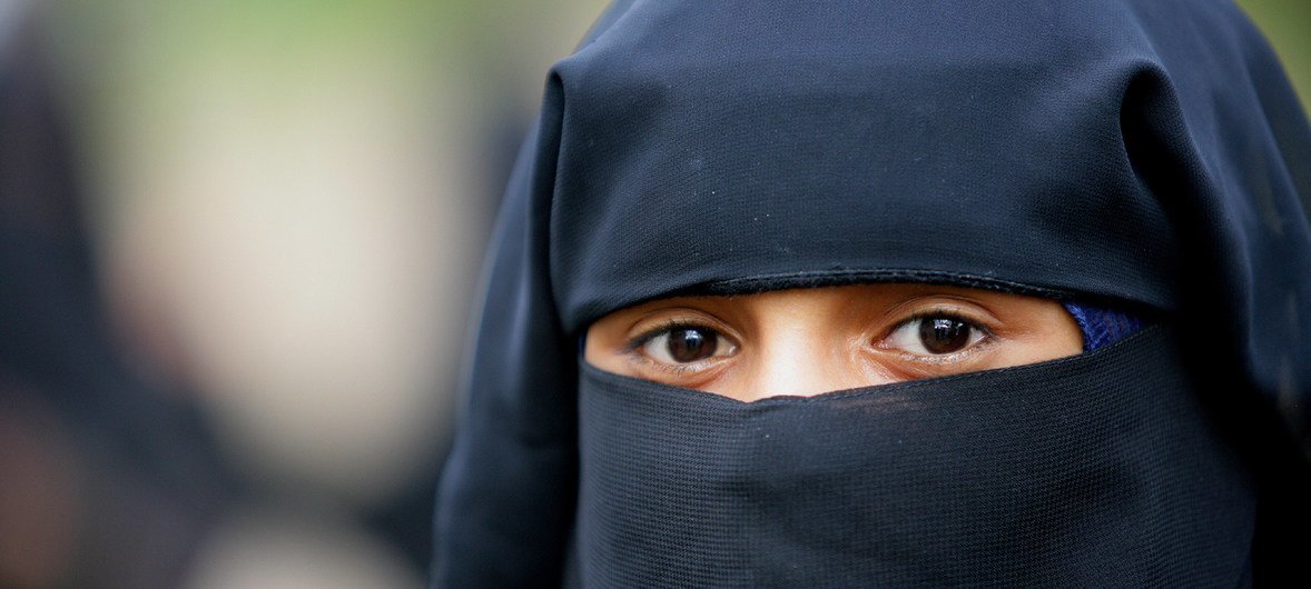 The niqab is a full-body Islamic piece of clothing, worn by some women in some devout Muslim communities, and which covers the whole body, leaving only a narrow slit for the eyes. Yemen, 2007.