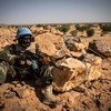 A peacekeeper from Guinea serving with the UN peacekeeping mission in Mali, MINUSMA, takes up position in the town of Kidal in the north of the country. (October 2018)