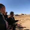 Alice Walpole, the Deputy Special Representative of the UN Secretary-General for Iraq, visits one of the mass grave sites in Kocho village, Sinjar, Nineveh governorate (northern Iraq). Faces have been blurred for protection reasons.