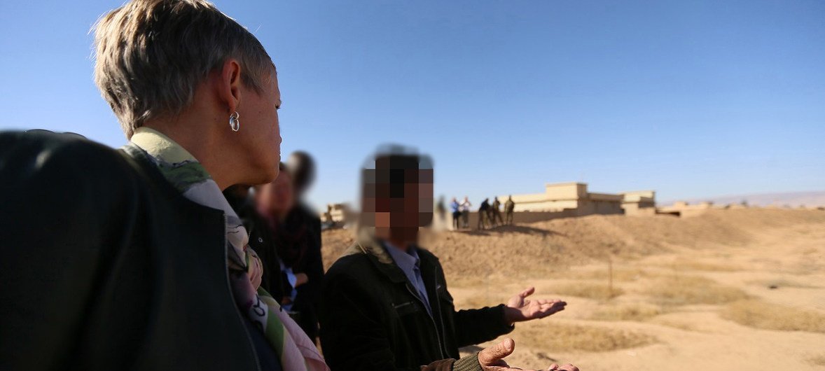 Alice Walpole, the Deputy Special Representative of the UN Secretary-General for Iraq, visits one of the mass grave sites in Kocho village, Sinjar, Nineveh governorate (northern Iraq). Faces have been blurred for protection reasons.