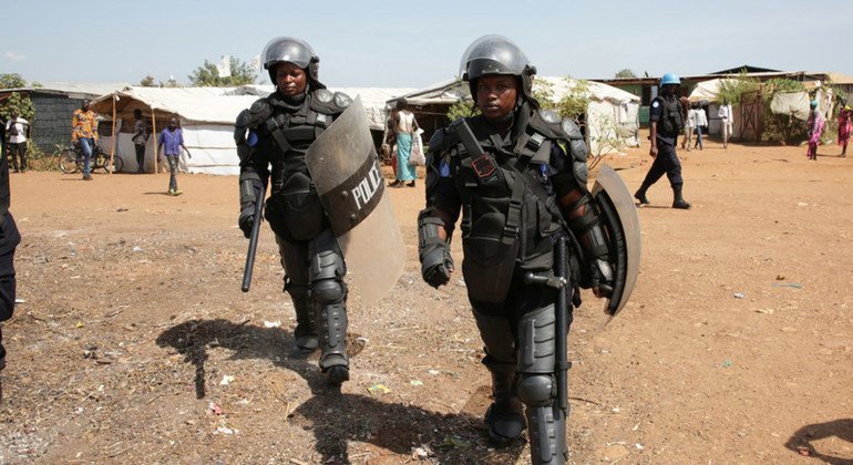 Female members of the Rwandan Formed Police Unit provide support for a visit by fellow United Nations officers to vulnerable women and children living in the Protection of Civilians site in Juba, South Sudan.