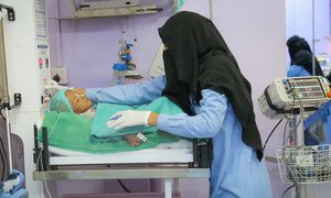 A health care worker examines a child being treated for severe acute malnutrition at the Al Thawra Hospital in Hudaydah, Yemen.  31 October 2018.