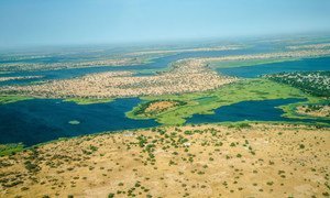 Aerial view over Lake Chad from the aeroplane, clearly shows patched of desertification. In the past 50 years, Lake Chad basin shrank from 25,000 square kilometers to 2,000square kilometers.