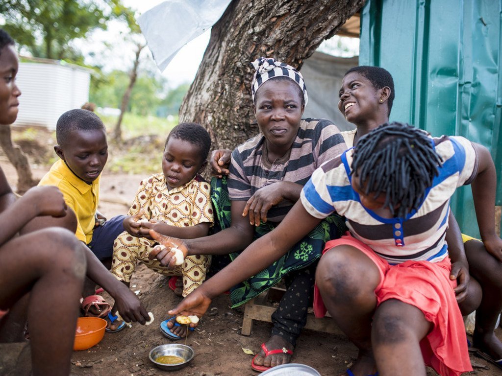 A refugee family from Cameroon sits outside their shelter at Adagom settlement in Ogoja province, south-east Nigeria.