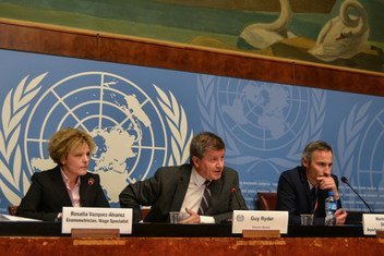 ILO Director-General Guy Ryder (center) speaks at press conference in Geneva.