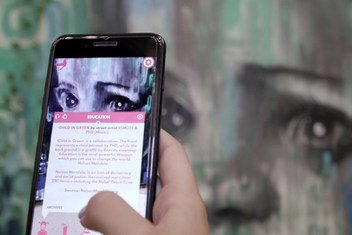 Co-founders of Street Art for Mankind developed the app “Behind the Wall” to enhance visitor interaction with their polysensorial exhibit on child trafficking. 