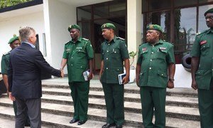 Under Secretary-General for United Nations Peacekeeping, Jean-Pierre Lacroix (left) greets members of the Tanzania People's Defence Force following the deaths a year ago of 15 Tanzanian peacekeepers  in the Democratic Republic of the Congo.