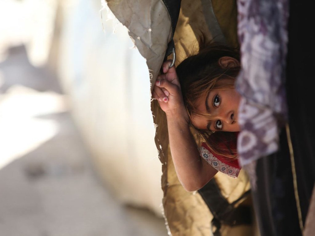 Une fille réfugiée palestinienne résidant au refuge collectif de l'UNRWA au camp de Khan Dunoun, en Syrie (2015).