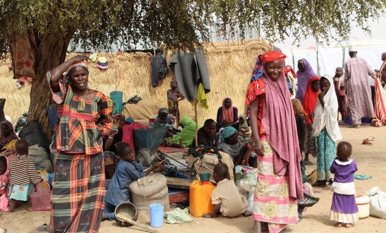 New arrivals in Gubio Camp in Maiduguri, Nigeria, following the attack in Baga. As the camp doesn't have enough shelters, people are sleeping on mats under trees.