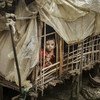 2018年7月24日，在缅甸若开邦，一名儿童在自己位于流离失所者营地的家中。
