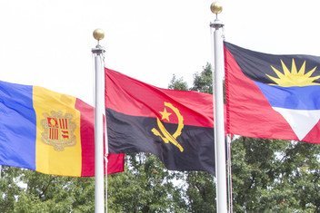 The flag of the Republic of Angola (centre) flying at United Nations Headquarters in New York.
