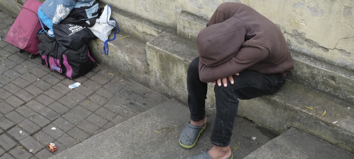 A Venezuelan refugee rests at the Rumichacha International Bridge, the main point of entry into Ecuador via Colombia.  In November 2018, some 2,500 Venezuelans were entering the country daily through this border.