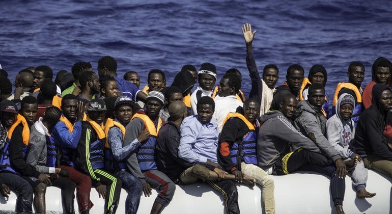 A boat filled with refugees and migrants from across Africa waits to be rescued by the Sea Watch vessel, in Libya.