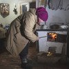 Living conditions of people in the conflict area in Eastern Ukraine. Stefania has been given four tons of coal by UNHCR, helping her to keep warm and cook.