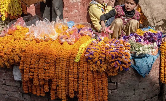 Children in Nepal sell flowers in a Durbar Square, Kathmandu.