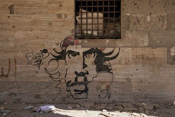 Graffiti on one of the walls in Benghazi destructed by the war