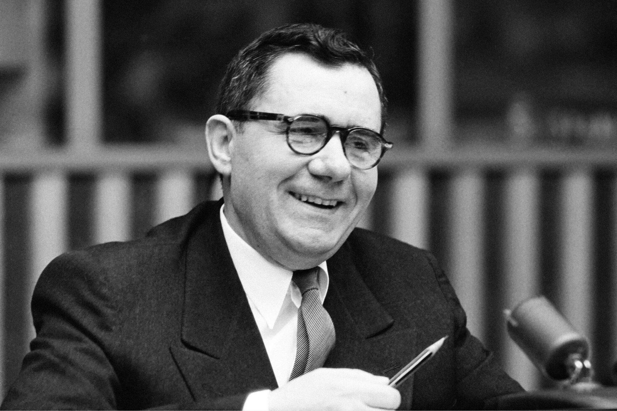 Soviet diplomat Andrei Gromyko smiles while holding a pen during a press conference at UN Headquarters.