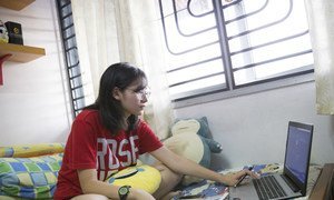 A student at the Sekolah Menengah Kebangsaan Subang Jaya school, studies at home home in Malaysia. The UN independent expert on minority rights says social media is being used with impunity to spread hate, and violence.
