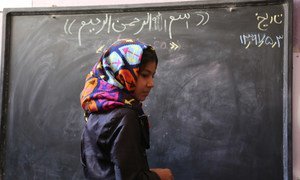 Afghanistan’s education system has been devastated by more than three decades of sustained conflict. For many of the country’s children, completing primary school remains a distant dream. Here, 10-year-old Fatima is on the board to solve a math question, at the ALC in Baghe Mellat, Herat. 